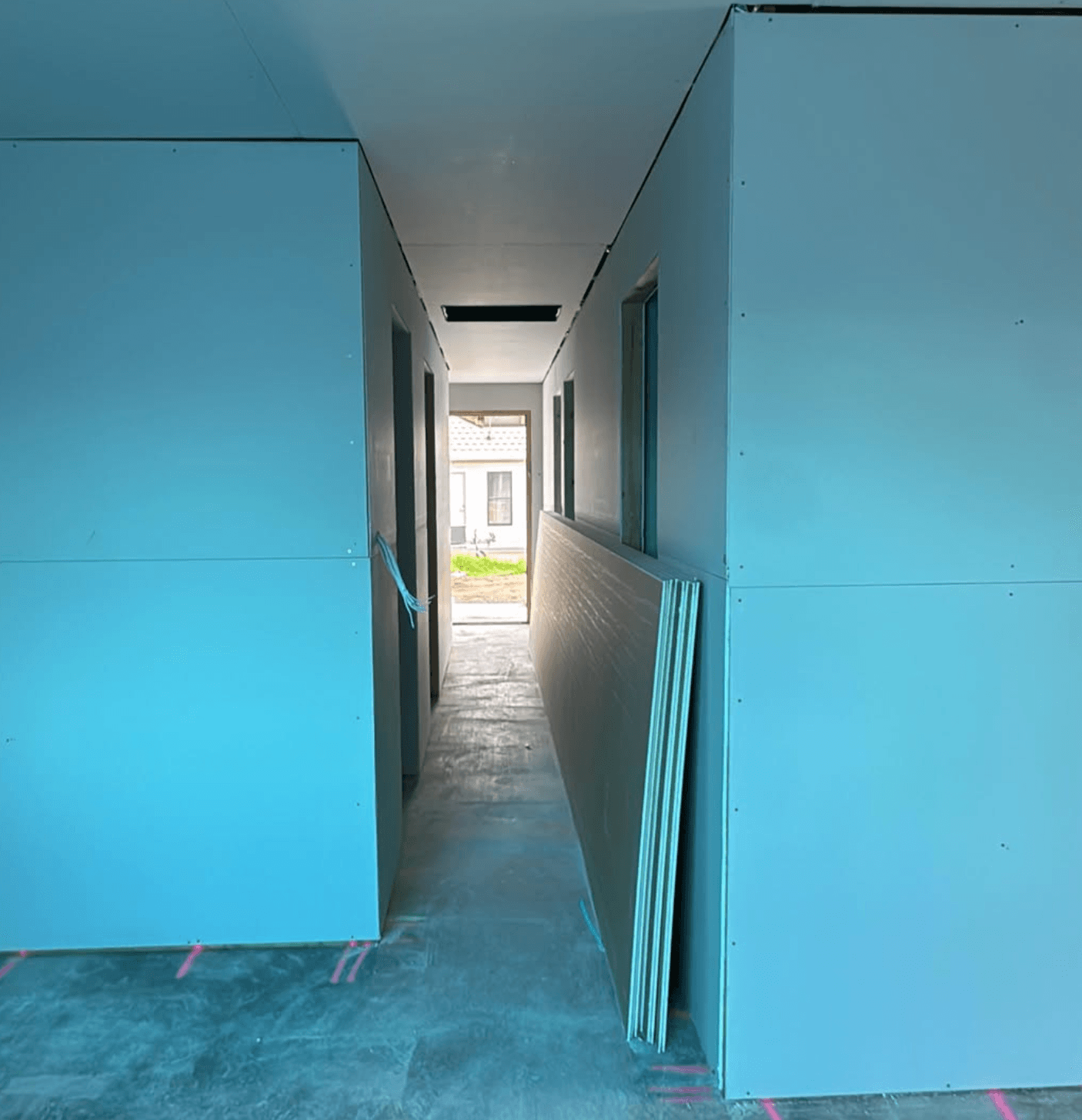 Gyprock fixed through a hallway on site